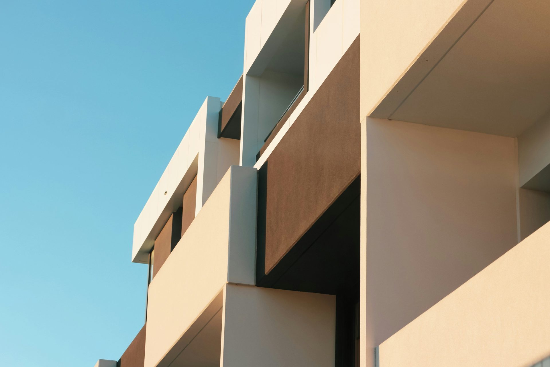 beige concrete building under blue sky during daytime