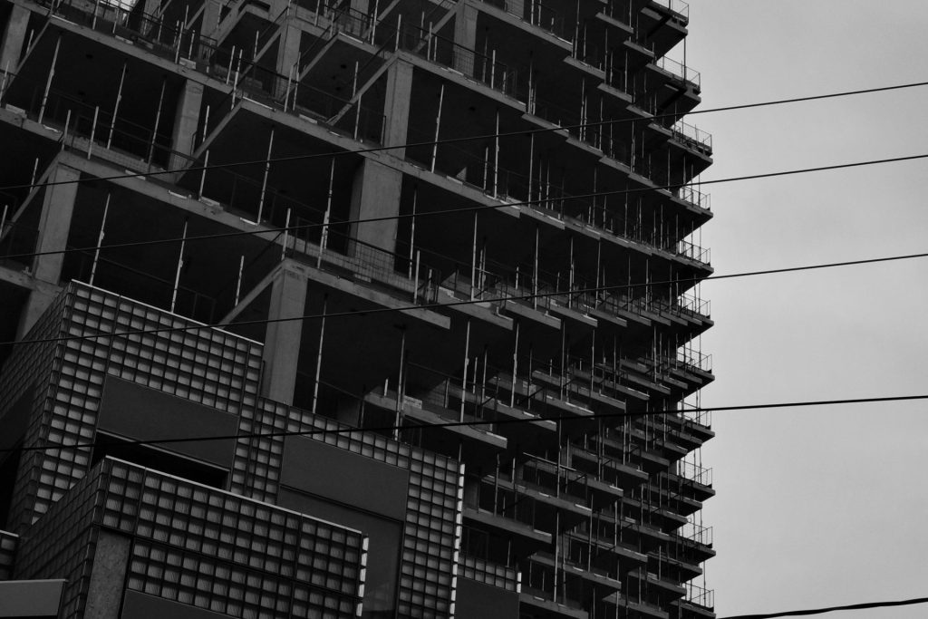 Skyscraper under construction with visible concrete framework
